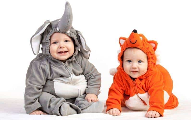 2 babies dressed up in halloween costumes
